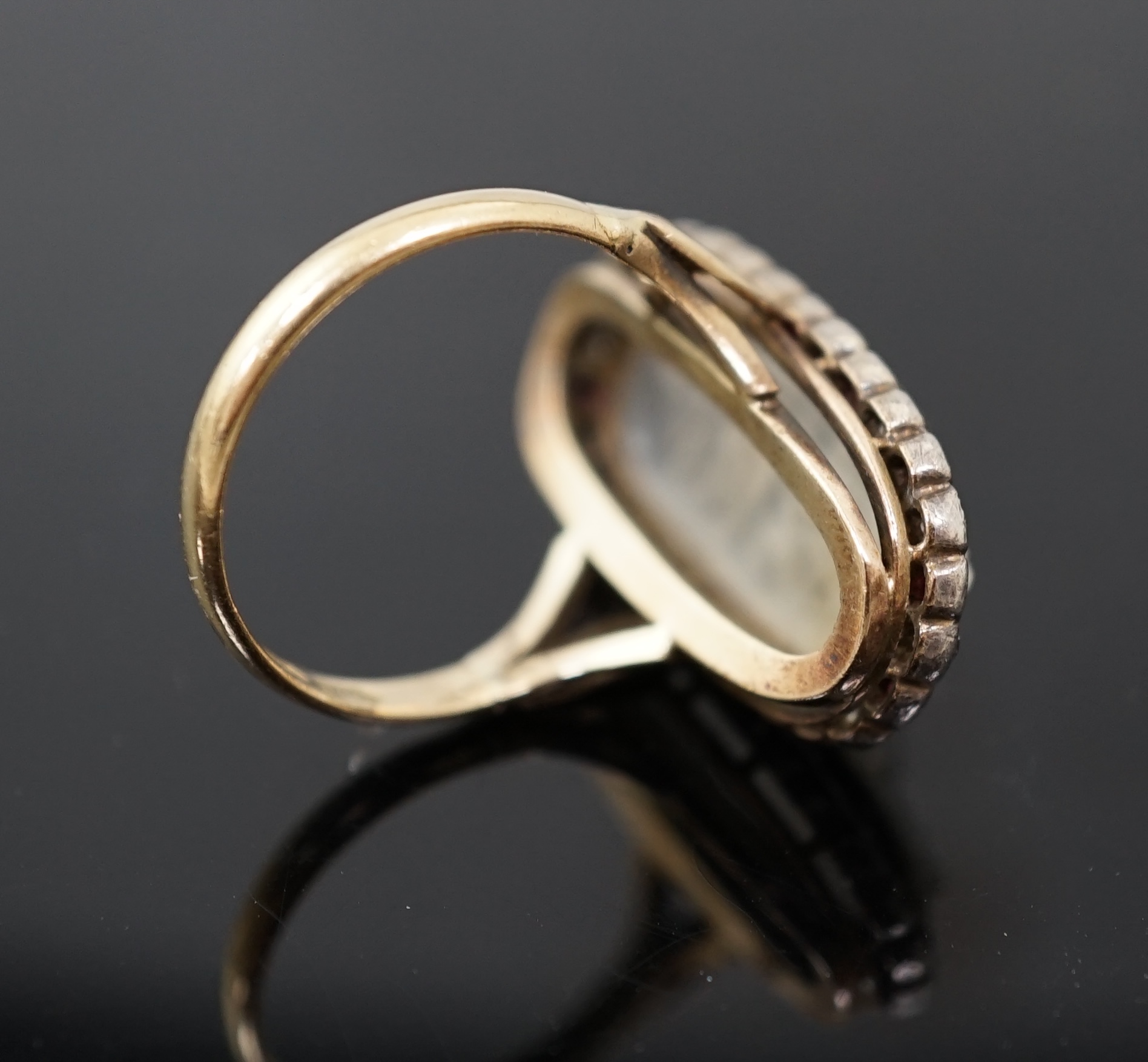 A 1930's continental 14k gold, moonstone?, ruby and diamond cluster set upfinger ring